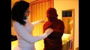 Mummified, bound and cuddled by woman